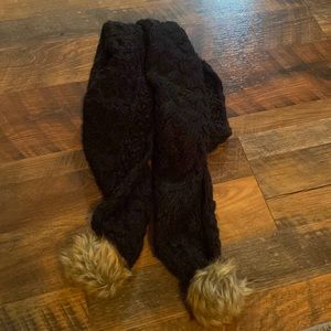 Knitted scarf with puff balls